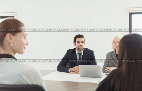 Executives interviewing new employees who will be responsible for the new business that is about to be launched. Стоковое фото, агентство Ingram Publishing / Фотобанк Лори