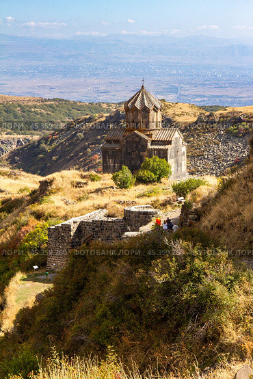 Famous view to ancient Vahramashen church of the 11th century, located near destroyed Amberd fortress in sunny summer day. Cliff with Arkashian River deep in canyon. Aragatsotn, Armenia. Стоковое фото, фотограф Алексей Ширманов / Фотобанк Лори