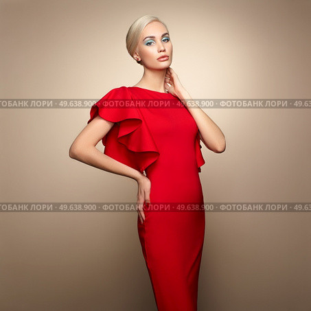 Fashion portrait of elegant woman with magnificent hair. Blonde girl. Perfect make-up. Girl in elegant red dress. Girl posing. Studio photo. Стоковое фото, агентство Ingram Publishing / Фотобанк Лори