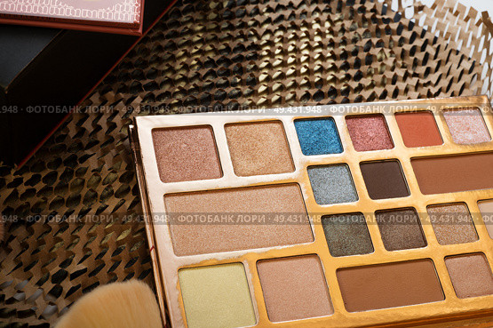 fashion set of new cosmetics palettes. unpacking. Стоковое фото, агентство Ingram Publishing / Фотобанк Лори