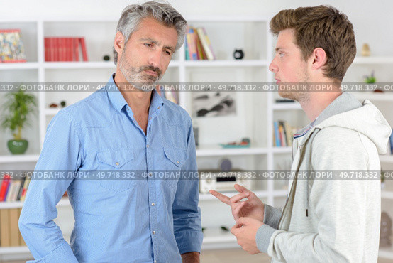 father and son having a conversation. Стоковое фото, агентство Ingram Publishing / Фотобанк Лори