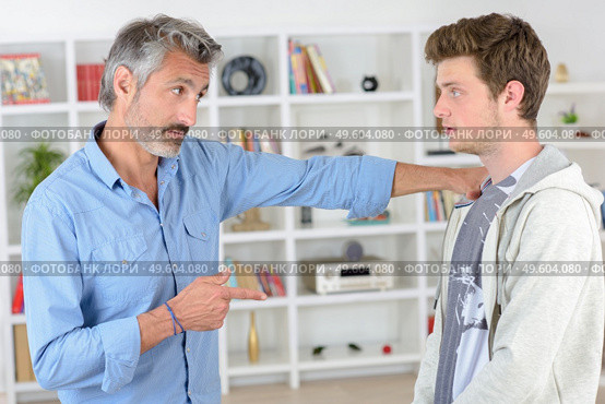 father and son talking to eachother. Стоковое фото, агентство Ingram Publishing / Фотобанк Лори