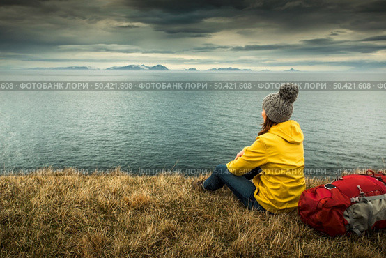 Female backpacker tourist in Icleand resting after a long day of adventures. Стоковое фото, агентство Ingram Publishing / Фотобанк Лори