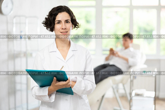 female doctor with folder. Стоковое фото, фотограф Яков Филимонов / Фотобанк Лори