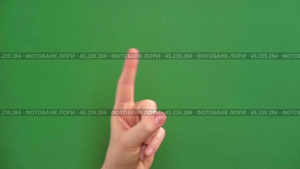 Female hand making warning gesture on Chroma key. Human hand showing her denial with index finger motion isolated on green. Stop sign, refusal, caution. Preventing subsequent problems. Body language. Стоковое видео, видеограф Марина Демидюк / Фотобанк Лори