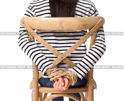 Female hostage sitting on chair against white background. Стоковое фото, фотограф Pixel_shot / Фотобанк Лори