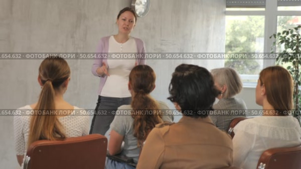 Female teacher is giving lecture for students in the university class. Стоковое видео, видеограф Яков Филимонов / Фотобанк Лори