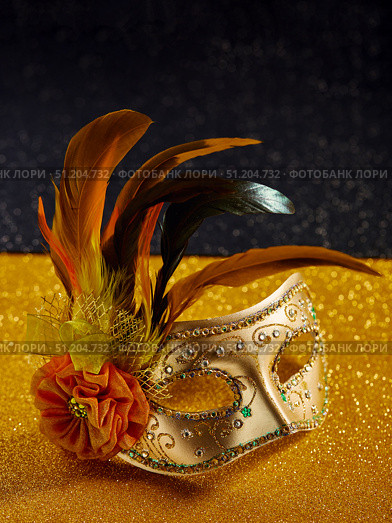Festive, colorful Mardi Gras or carnivale mask on golden background. Venetian masks. Стоковое фото, фотограф Ирина Буракова / Фотобанк Лори