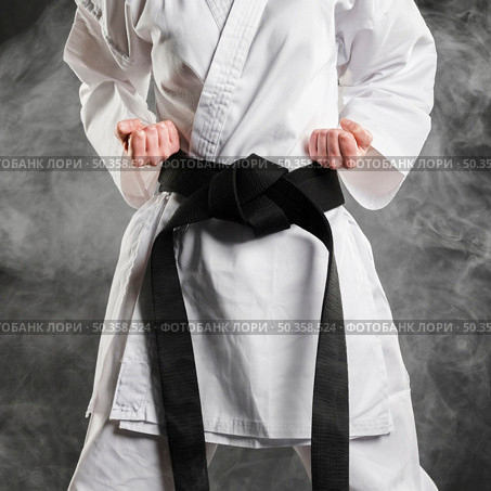 fighter kimono with black belt. Стоковое фото, агентство Ingram Publishing / Фотобанк Лори