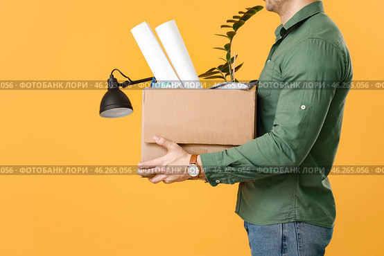 Fired man with personal things on color background. Стоковое фото, фотограф Pixel_shot / Фотобанк Лори