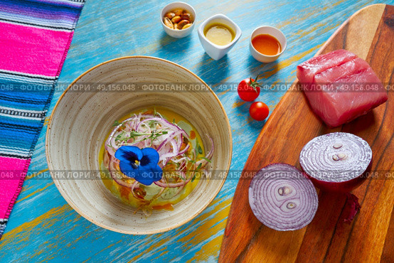 Fish ceviche latin preuvian recipe on bowl with pansy flower. Стоковое фото, агентство Ingram Publishing / Фотобанк Лори