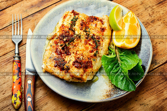 Fish fried in orange oil, delicious seafood. Filet o fish. Fried fish fillets in orange oil. Стоковое фото, агентство Ingram Publishing / Фотобанк Лори