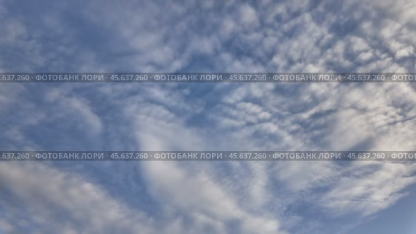 Floating fluffy clouds. Beautiful sunny blue sky with wispy smoky white cumulus and cirrus on different layers. Timelapse. Стоковое видео, видеограф Наталия Попова / Фотобанк Лори