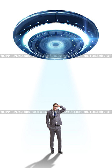 Flying saucer abducting young businessman. Стоковое фото, фотограф Elnur / Фотобанк Лори