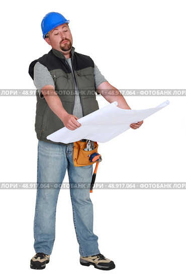Foreman going over plans. Стоковое фото, агентство Ingram Publishing / Фотобанк Лори