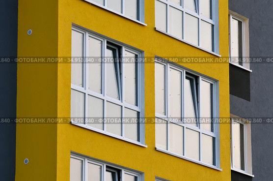 Fragment of a new multi-storey residential public building. Стоковое фото, фотограф Сергей Трофименко / Фотобанк Лори