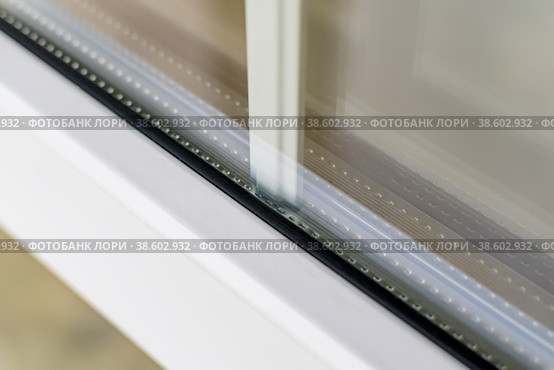Fragment of double glazing with white sprats. Стоковое фото, фотограф Siarhei Starastau / Фотобанк Лори