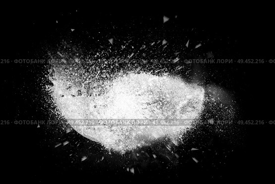 Freeze motion of colorful powder paint exploding isolated on black dark background. Abstract design of color dust cloud. Particles explosion screen saver, wallpaper, brush. Стоковое фото, агентство Ingram Publishing / Фотобанк Лори