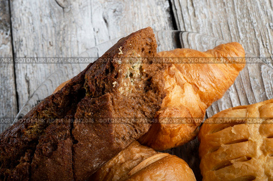 fresh french bakery  around old style background . close up . flat lay. Стоковое фото, агентство Ingram Publishing / Фотобанк Лори