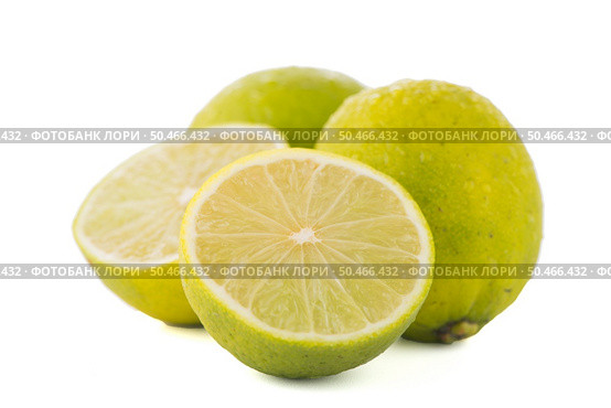 Fresh green limes isolated on white background. Стоковое фото, агентство Ingram Publishing / Фотобанк Лори