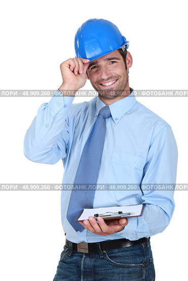 Friendly chap with a clipboard and helmet. Стоковое фото, агентство Ingram Publishing / Фотобанк Лори