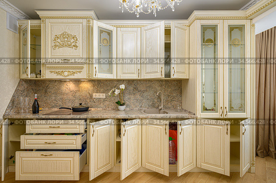 Front view of luxury modern neoclassic beige kitchen interior. Стоковое фото, фотограф Сергей Старуш / Фотобанк Лори