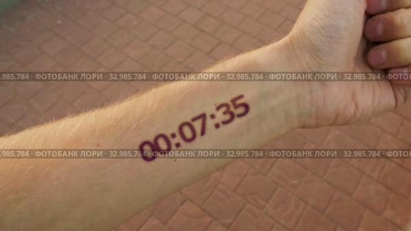 Futuristic stopwatch like a tattoo on the hand. Стоковое видео, видеограф Dzmitry Astapkovich / Фотобанк Лори