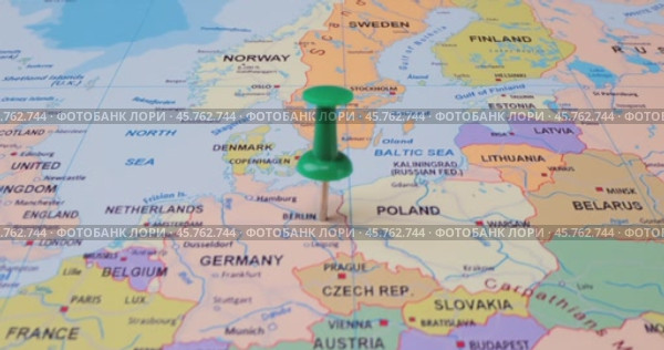Germany - Travel concept with green pushpin on the world map. The location point on the map points to Berlin, the capital of the German. Стоковое видео, видеограф Андрей Армягов / Фотобанк Лори
