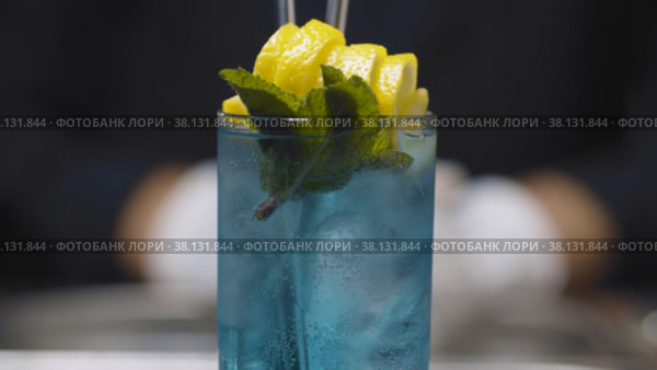 Glass of Blue Lagoon Cocktail. Стоковое видео, видеограф Татьяна Чудакова / Фотобанк Лори