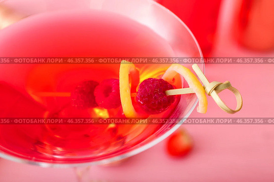 Glass of tasty cosmopolitan cocktail on color wooden background, closeup. Стоковое фото, фотограф Pixel_shot / Фотобанк Лори