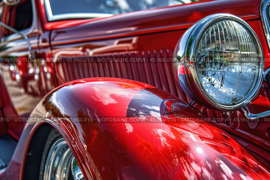 Gleaming red vintage car showcasing classic design and chrome headlight. Стоковое AI-изображение, AI-художник Иван Рябоконь / Фотобанк Лори