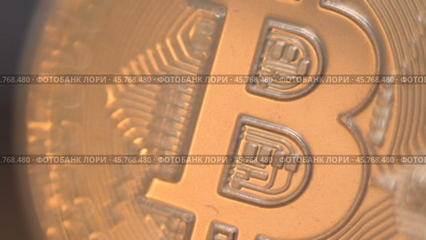 Gold Bitcoin Symbol beautifully placed on a Wooden Surface. Close up. Стоковое видео, видеограф Степанов Григорий / Фотобанк Лори