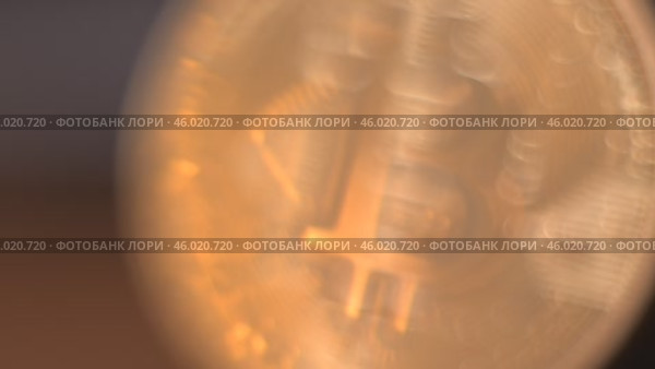 Gold Bitcoin Symbol beautifully placed on a Wooden Surface. Close up. Стоковое видео, видеограф Степанов Григорий / Фотобанк Лори