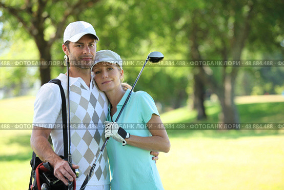 Golfing couple. Стоковое фото, агентство Ingram Publishing / Фотобанк Лори
