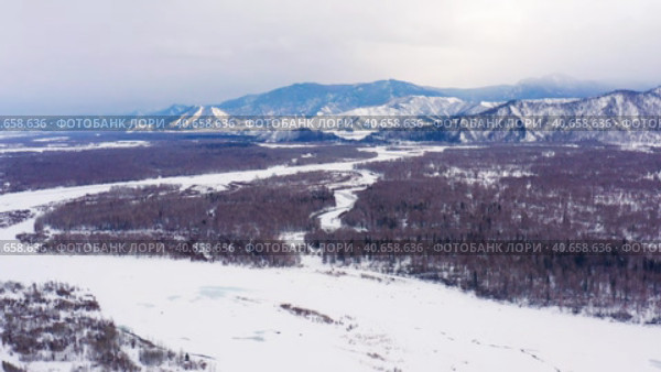 Горный Алтай зимой: Катунский хребет. Вид с воздуха. Altai mountains in winter: Katunsky ridge. Aerial view. Стоковое видео, видеограф Евгений Романов / Фотобанк Лори