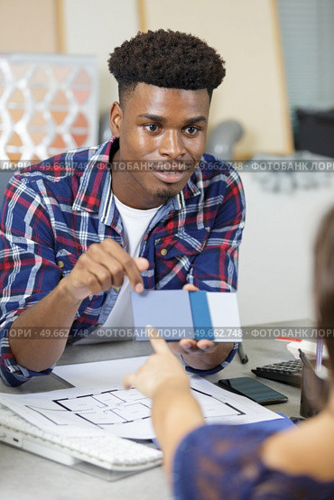 graphic designer man creative using color swatch samples. Стоковое фото, агентство Ingram Publishing / Фотобанк Лори