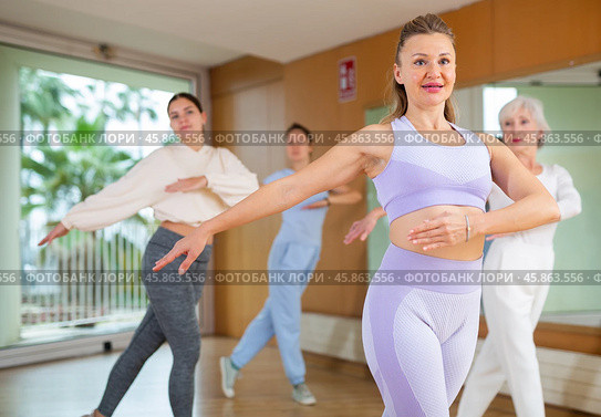 Group are practising arch movement in step jazz dance in fitness gym. Стоковое фото, фотограф Яков Филимонов / Фотобанк Лори