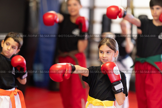 Group of children in boxing gloves are training in gym. Стоковое фото, фотограф Яков Филимонов / Фотобанк Лори