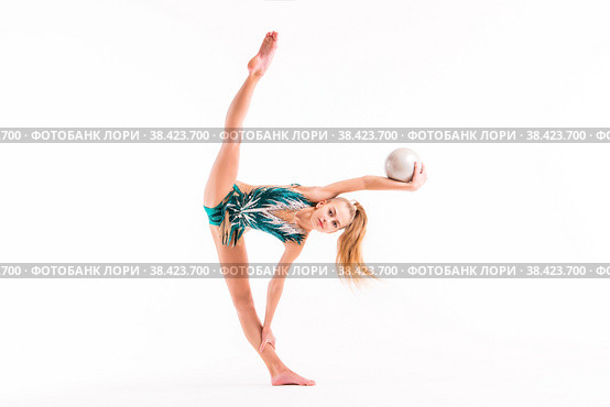 Gymnast girl in an emerald swimsuit performs an exercise with a ball isolated on white background. Стоковое фото, фотограф Мария Мороз / Фотобанк Лори