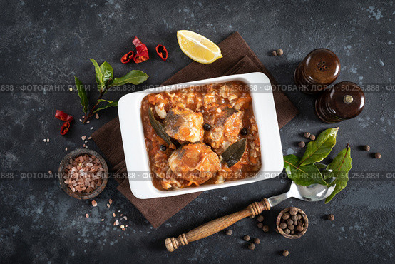 Hake fish, cooked in tomato sauce with vegetables and spices. Стоковое фото, агентство Ingram Publishing / Фотобанк Лори