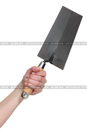 Hand holding a bucket trowel. Стоковое фото, агентство Ingram Publishing / Фотобанк Лори