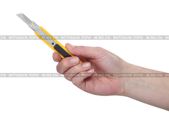 Hand holding a utility blade. Стоковое фото, агентство Ingram Publishing / Фотобанк Лори