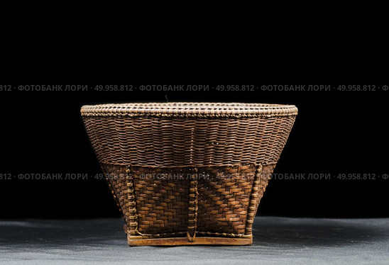 Hand woven bowl from Northern Thailand. Стоковое фото, агентство Ingram Publishing / Фотобанк Лори