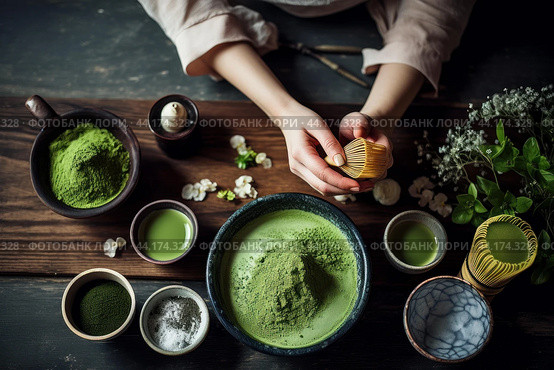 Hands whisking matcha powder in a bowl during a tea ceremony. Стоковое AI-изображение, AI-художник Иван Рябоконь / Фотобанк Лори