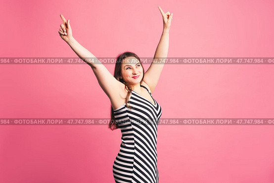 Happy pize size model in striped dress, fat woman on purple background. Стоковое фото, фотограф Станислав Тарко / Фотобанк Лори