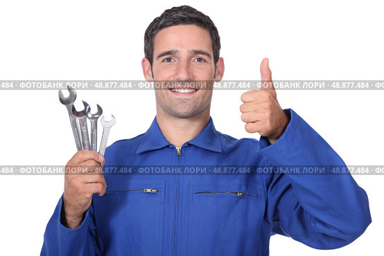 head and shoulders portrait of plumber holding wrenches all smiles. Стоковое фото, агентство Ingram Publishing / Фотобанк Лори