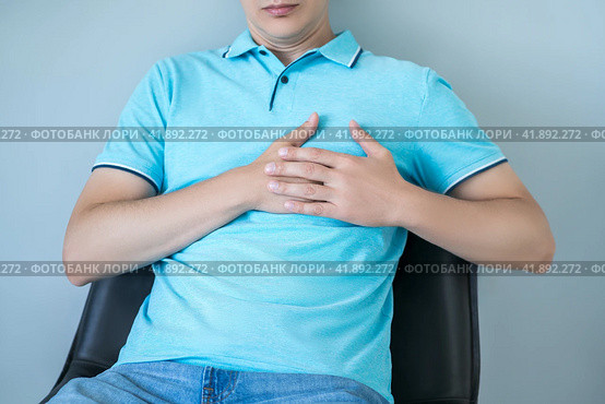 Heart attack, man with chest pain suffering at home, myocardial infarction. Стоковое фото, фотограф Станислав Тарко / Фотобанк Лори