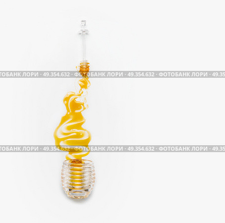 Honey poured from glass jar with dipper  on white background, top view. Healthy  food. Стоковое фото, агентство Ingram Publishing / Фотобанк Лори