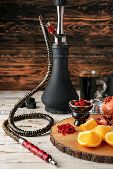 Hookah with tobacco and fresh fruits on table. Стоковое фото, фотограф Pixel_shot / Фотобанк Лори