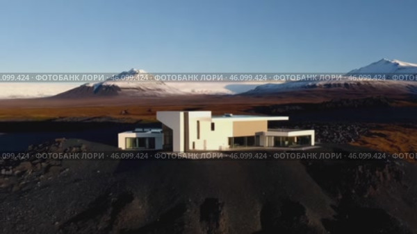 House is on a hill with a view of mountains. Стоковое AI-видео, аниматор Sergey Grishin / Фотобанк Лори